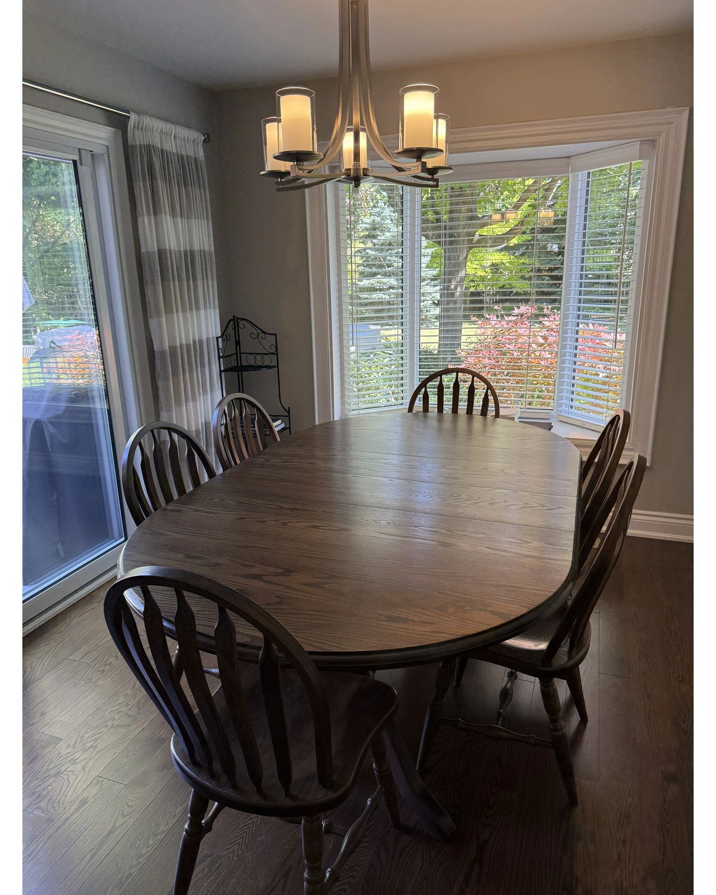 Restored dining room with oval table and Windsor chairs