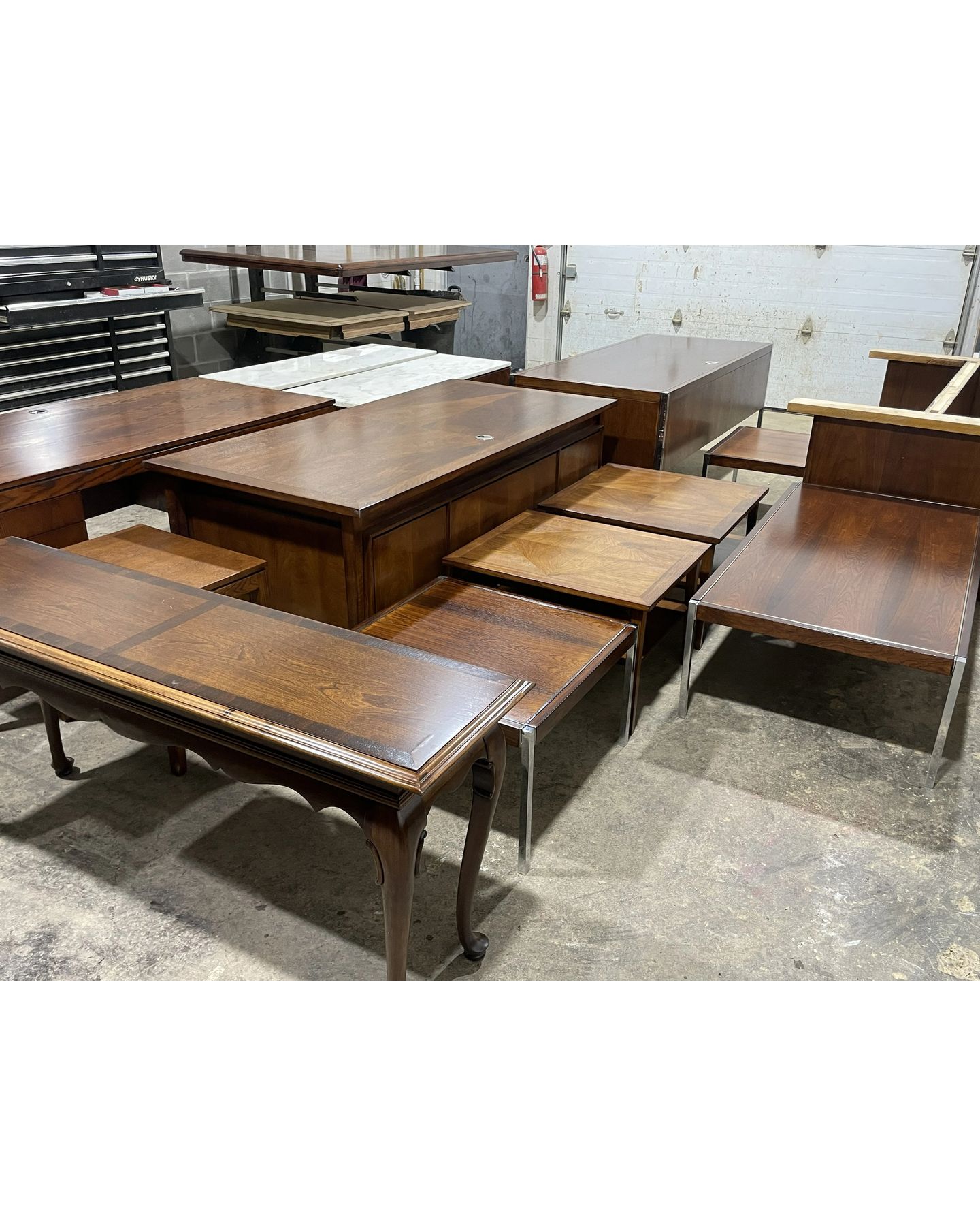 Mid-century style tables in warehouse